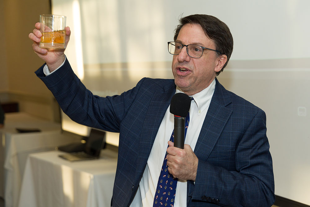 Joshua Cohn offers a toast